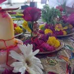 Flowers and a lord Shiv statue